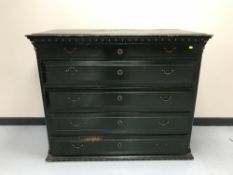 An antique pine painted five drawer chest