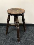 An early 20th century oak stool