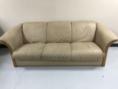 A Ekorney leather three seater settee