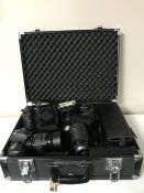 A camera case containing a Nikon D3 camera and a Nikon D100 camera,
