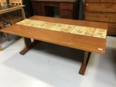 A late 20th century teak tiled top table