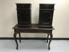 A contemporary hardwood two-drawer console table together with a pair of bedside cabinets with