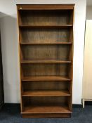 Two sets of Yewwood open bookshelves