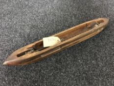 A vintage loom shuttle