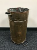 An antique copper bucket