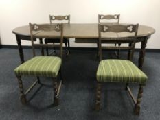 A circular continental oak dining table,