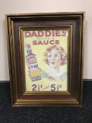A framed Daddie's Famous Sauce advertisement