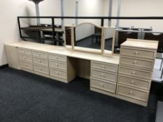 A contemporary five piece bedroom set in a washed pine finish