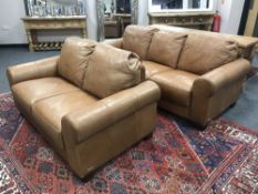 A tan leather Sofitalia three seater settee and matching two seater settee,