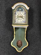 An early twentieth century painted wall clock with hood (one weight)