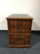 A yewwood two drawer filing chest with inset green leather panel