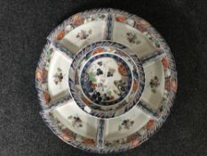 A seven piece china chip and dip platter on a lazy Susan