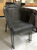 Four stacking metal garden armchairs