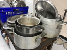 Five stainless steel cooking pots with lids (odd)