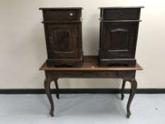 A contemporary hardwood two-drawer console table together with a pair of bedside cabinets with