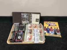 A tray containing four boxed die cast vehicles, Formula 1 cars and a James Bond Aston Martin,
