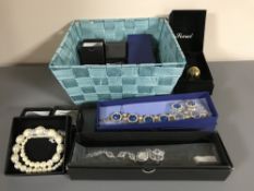 A basket of a collection of costume jewellery, necklaces,
