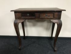 A contemporary hardwood two-drawer console table