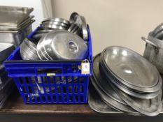 A box of stainless steel dishes with covers and quantity of stainless steel trays