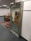A tall rectangular silvered mirror,