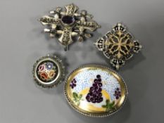 Four good quality silver brooches.