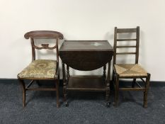An oak dropleaf two tier tea trolley together with an oak ladder back rush seated bedroom chair and