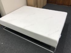 An Ergoflex memory foam king size mattress, new and boxed.