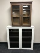 An oak double door bookcase and a painted double door bookcase