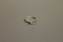 A platinum diamond solitaire ring, approximately 0.72ct, size H.