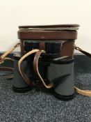 A pair of Swift binoculars in leather case CONDITION REPORT: Leather case a/f.