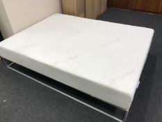 An Ergoflex memory foam king size mattress, new and boxed.