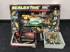 A box of Scalectrix Formula 1 racing set, with extra track,