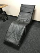 A black faux leather lounger chair