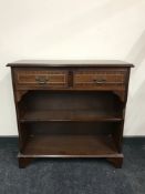 A set of inlaid mahogany open bookshelves fitted two drawers