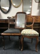Two antique mahogany dining chairs together with a mahogany framed mirror