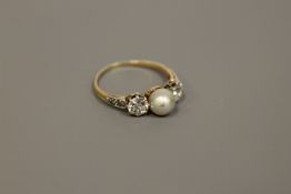 An early 18ct gold pearl and diamond ring