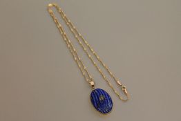 A 9ct gold mounted lapis lazuli pendant on chain