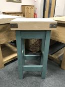 A reclaimed pine painted narrow kitchen work block