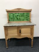 A satin walnut and marble topped wash stand
