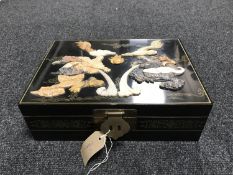 An Oriental black lacquered jewellery box