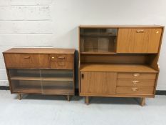 A teak sliding glass door bureau bookcase together with a teak effect cocktail sideboard