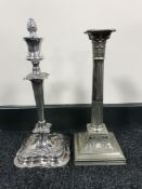 A plated Corinthian column candlestick together with one other