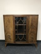 A mid 20th century walnut glazed door display cabinet
