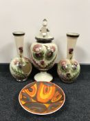 A Poole pottery bowl and an early 20th century hand painted vase trio