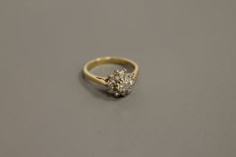 An 18ct gold diamond cluster ring,