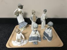 A tray of five Spanish figures and a Leonardo cherub ornament