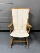 A pine effect rocking chair