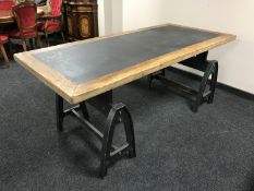 A contemporary trestle table on industrial style supports