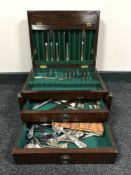 A mahogany part canteen of plated cutlery