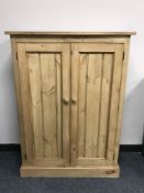 A reclaimed pine two door cabinet